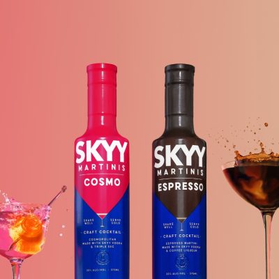 SKYY Cosmo and SKYY Espresso Martini bottles side by side, with their respective cocktails splashing dramatically.