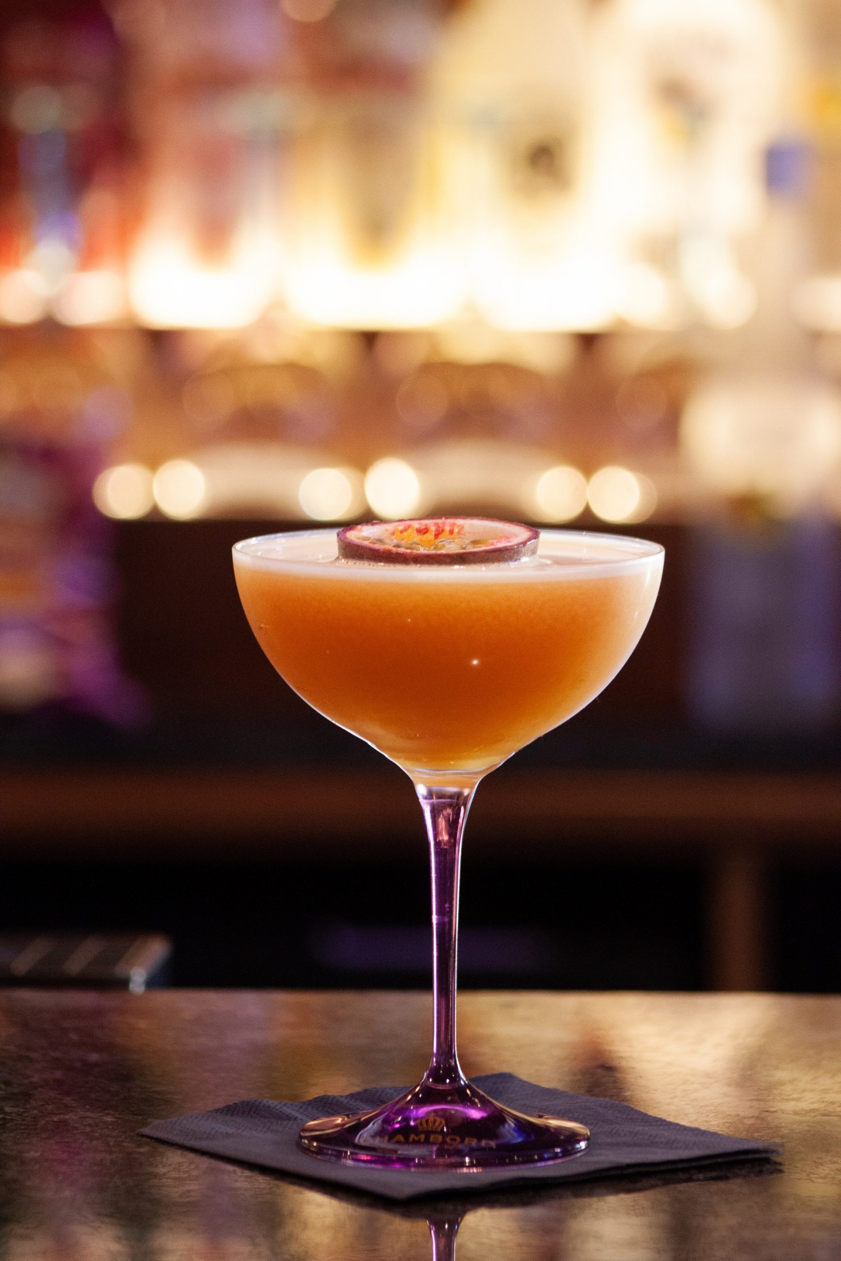 Close up shot of a Pornstar Martini with passionfruit garnish