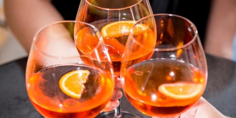 Three hand held aperitif cocktails