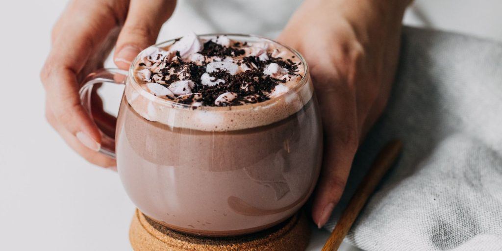 Glass mug of chocolate buttered rum with marshmallows