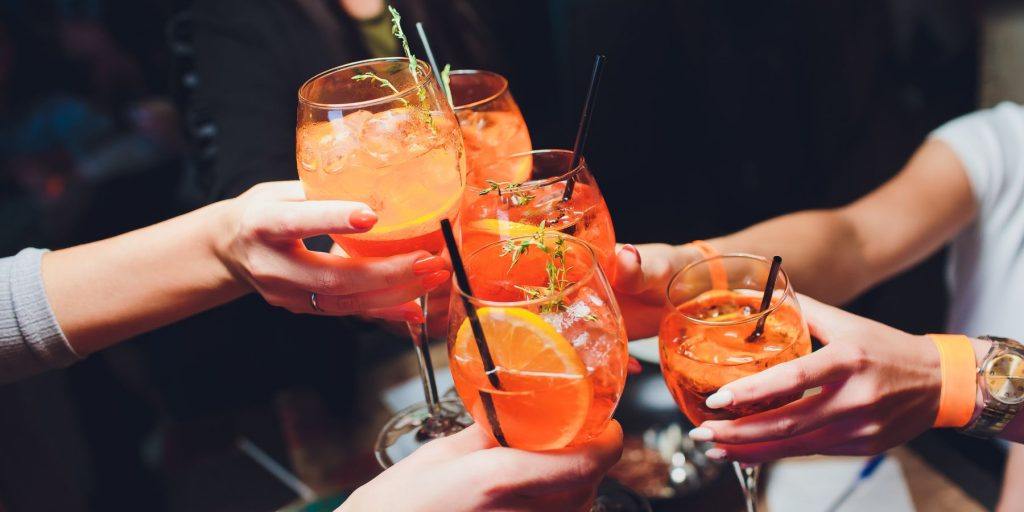 Girls toasting with Aperol Spritz