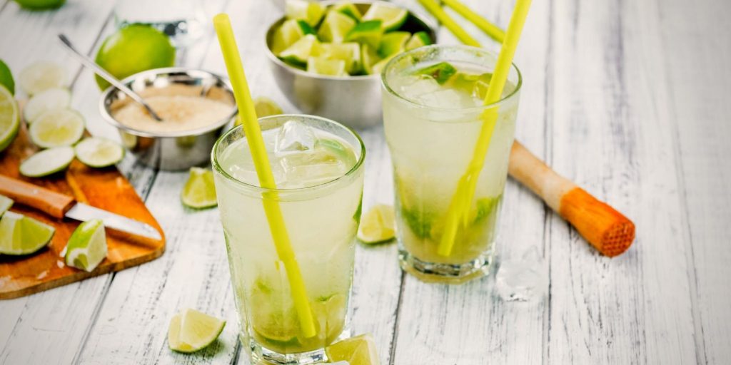 Refreshing Caipirinhas with muddled lime