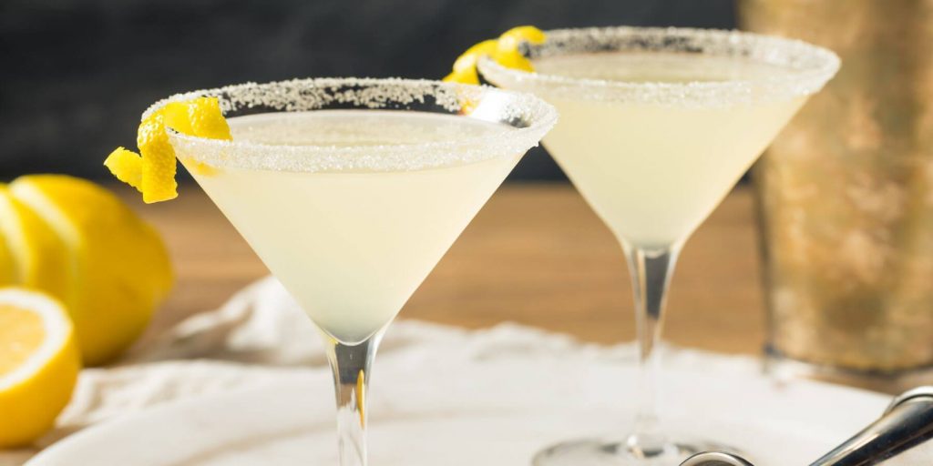 Limoncello martini in cocktail glasses with a lemon twist
