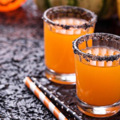 Halloween pumpkin orange cocktails. Festive drink. Banner for design site