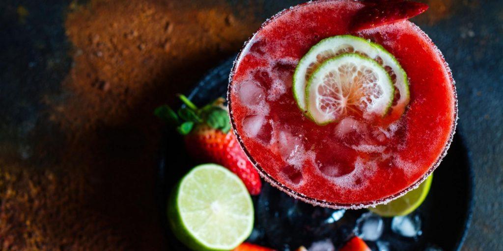 Overhead Strawberry margarita with lime