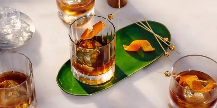 Top view of rich Old Fashioned Cocktails with Orange peel garnish