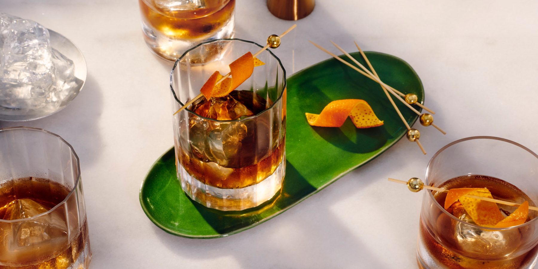 Top view of rich Old Fashioned Cocktails with Orange peel garnish