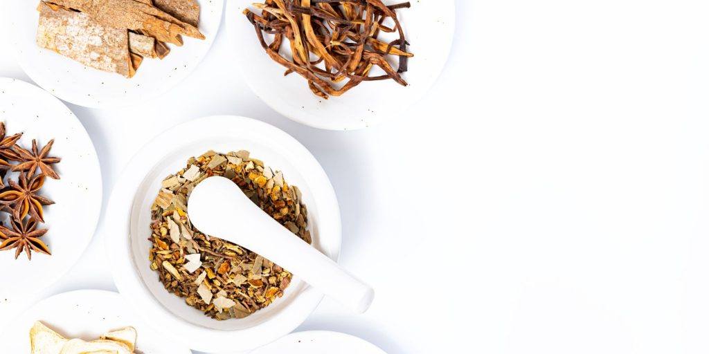 Spices in bowls on a white background