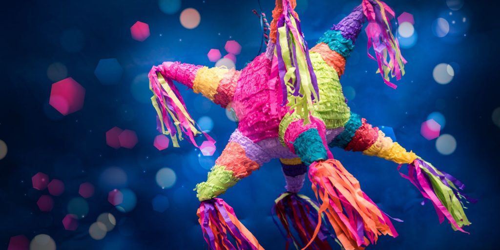 Pinata with blue background and sparkly decor