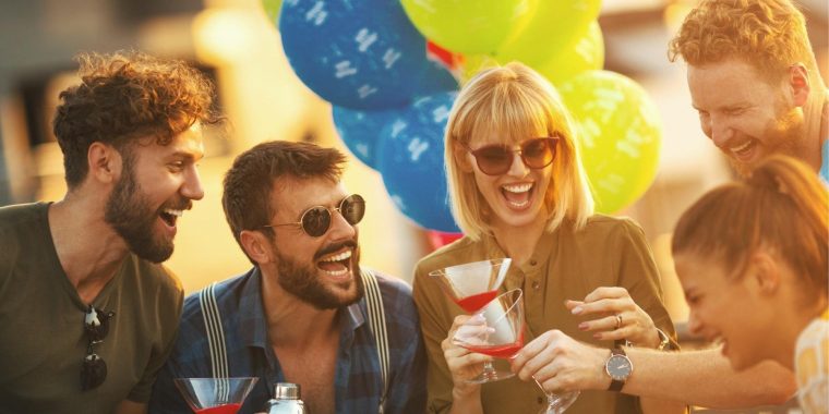 Group of friends enjoying a rooftop cocktail party