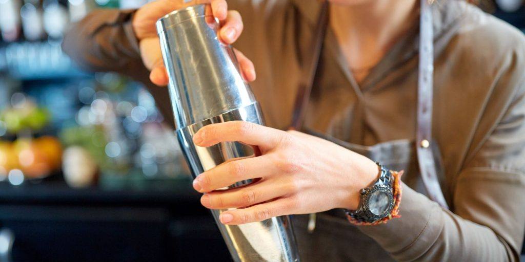 Bartender shaking with a Boston shaker