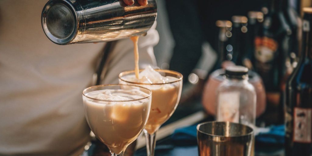 Bartender pouring from a shaker