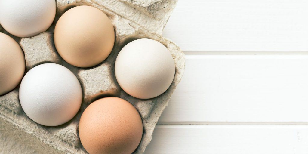 Chicken eggs in a box from above