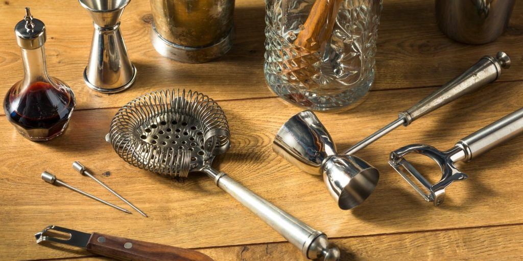 Selection of metal bar tools on wooden table