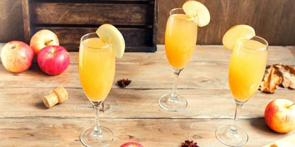 Apple Cider Mimosas with apple slice garnish