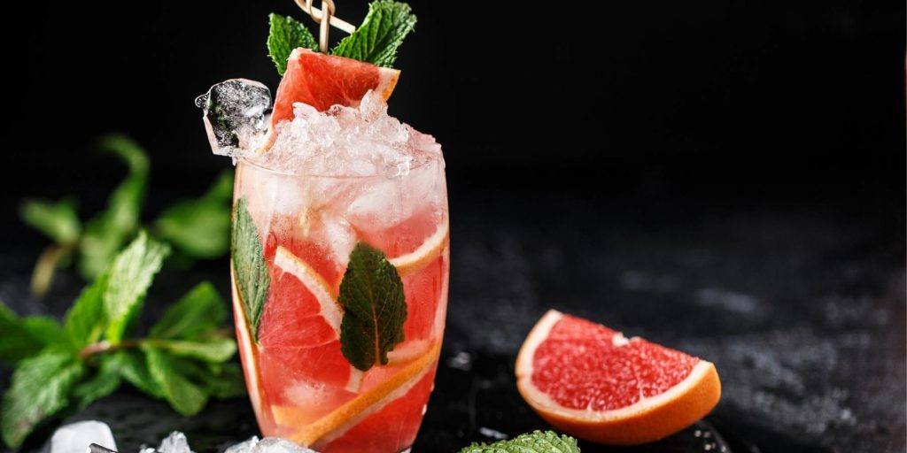 Refreshing non-alcoholic grapefruit spritzer with fresh mint garnish