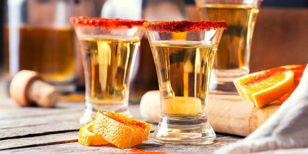 Shots of mezcal with chili salt