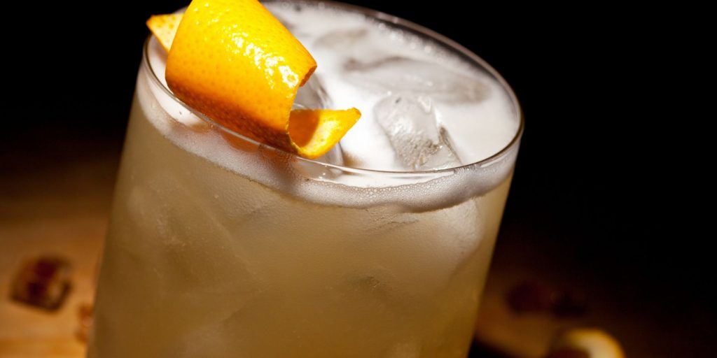 Creamy coconut gin sour with orange twist