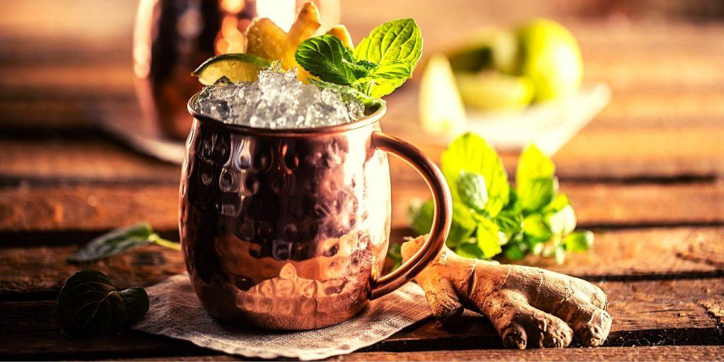 Mexican Mule cocktail with fresh ginger in a copper mug