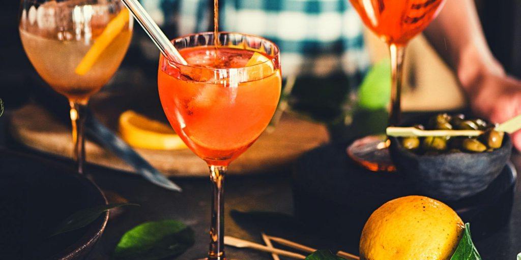 Front view of Aperol being poured into a cocktail 