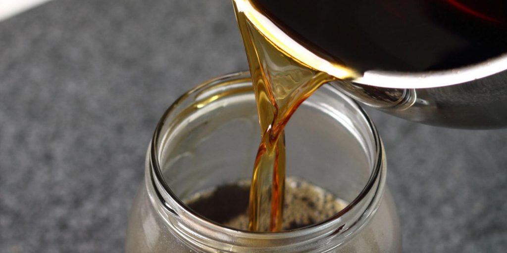 Rich syrup poured into a glass jar