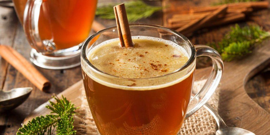 Hot buttered rum with a cinnamon stick