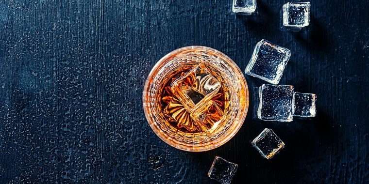 Top shot of Japanese whiskey drink with ice cubes