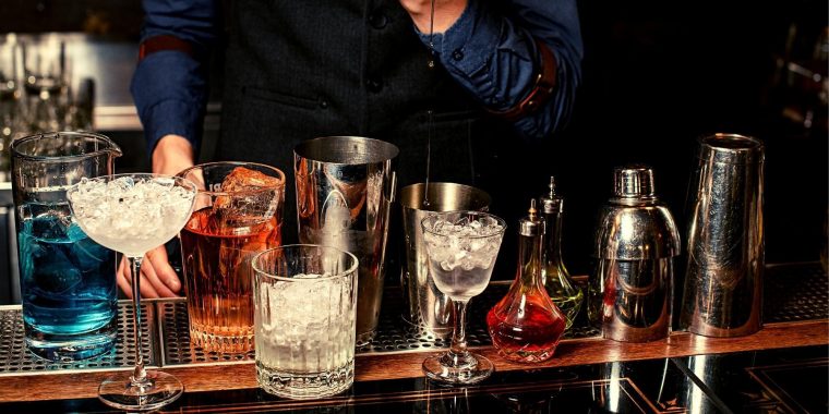 Bartender measuring a single pour of liquor