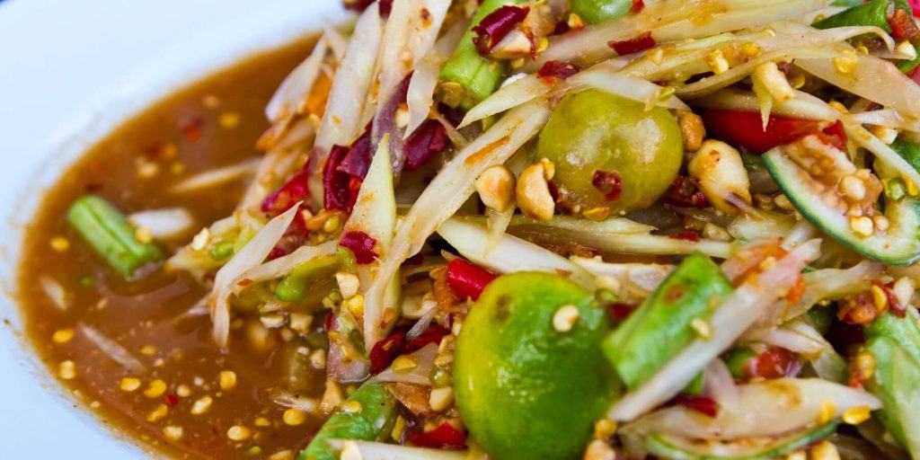 Close up of a spicy green papaya salad