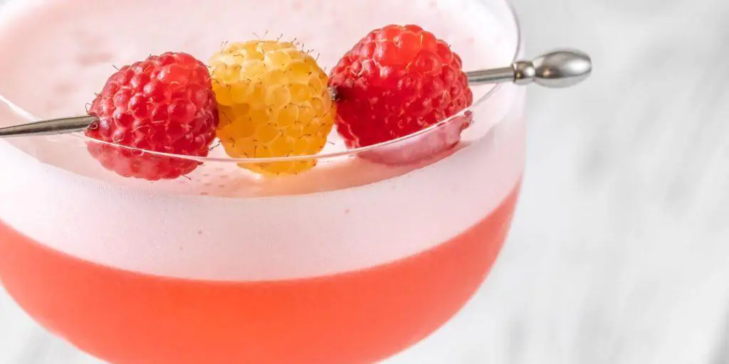 Raspberry garnish on a cocktail pin