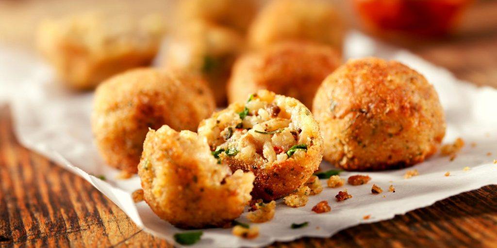 Golden Arancini on parchment paper