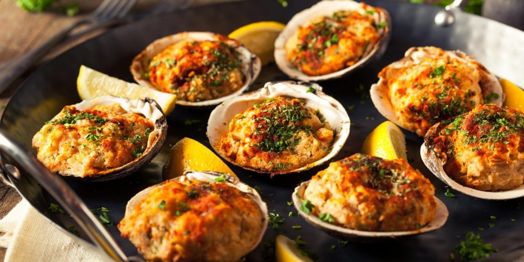 Clams Casino with lemon wedges