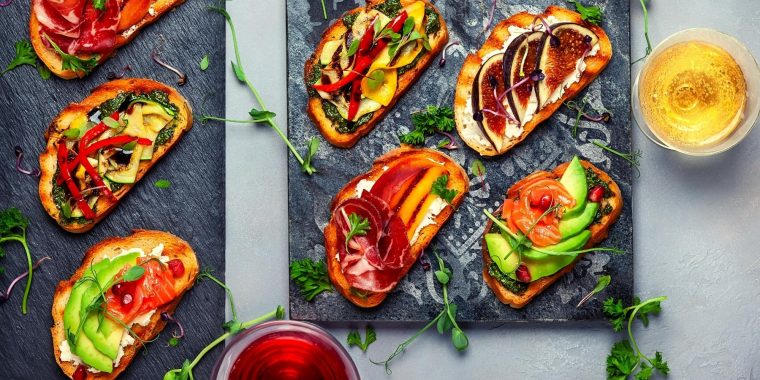 Top view of colorful Bruschetta appetizer with wine
