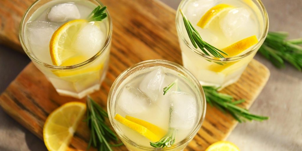 Glasses of vodka with homemade lemonade and rosemary