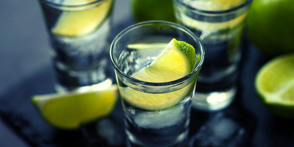Vodka with lime wedges
