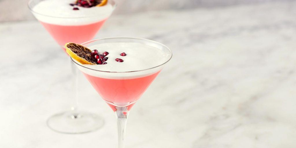 Pomegranate Cosmopolitans with dried orange garnish