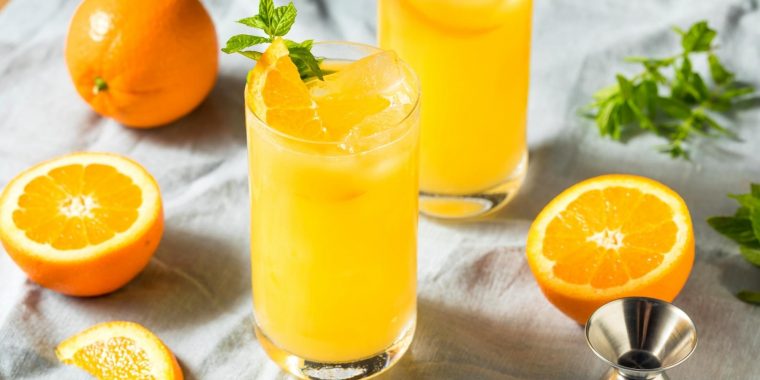 Two Orange Crush Cocktails with orange garnish
