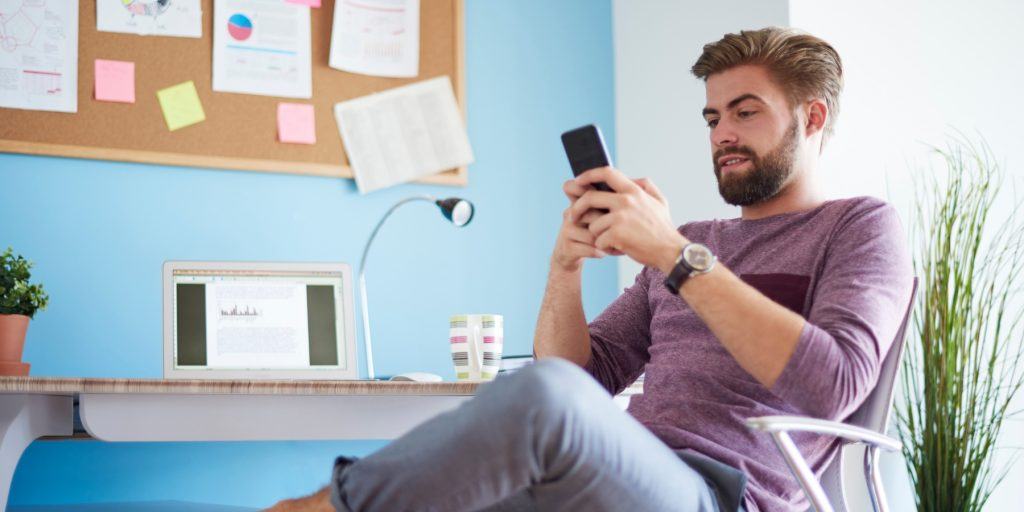 A guy texting on his phone