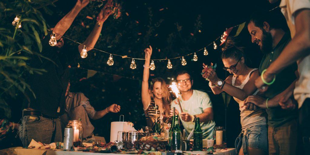 A group of friends celebrating around a table