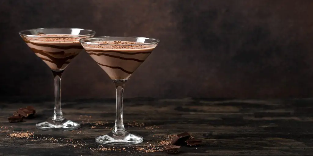Two Mudslide cocktails in Martini glasses
