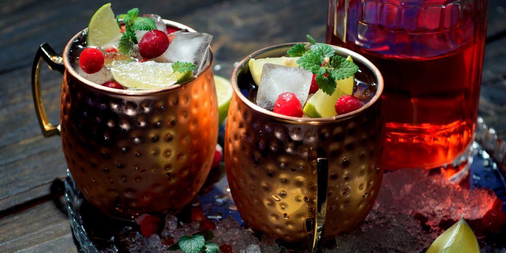 Two Cranberry Moscow Mule cocktails