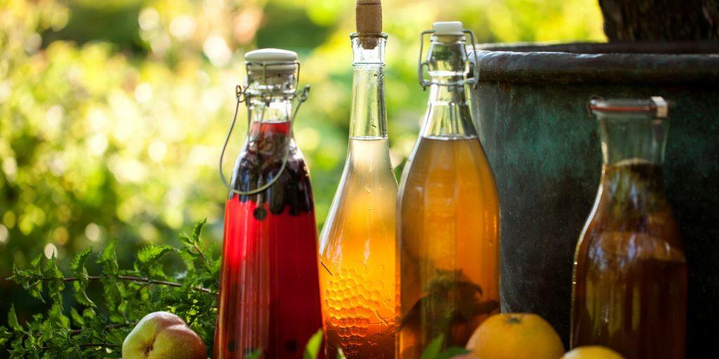 Bottles of vinegar syrup outdoors