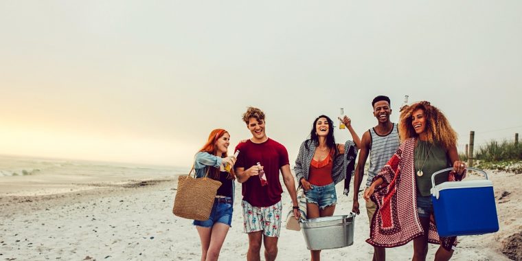 Friends carrying cooler boxes to BYOB Party