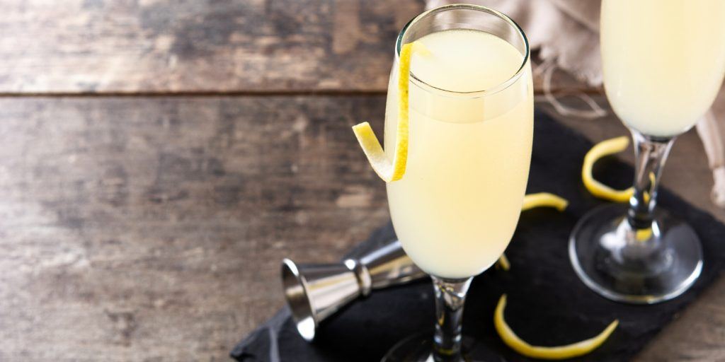Two French 75 cocktails garnished with lemon