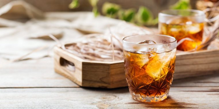 Two Averna cocktails on a wooden table