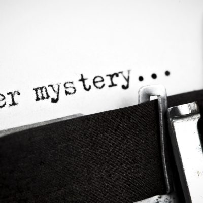 Typewriter with the word Murder Mystery typed on paper