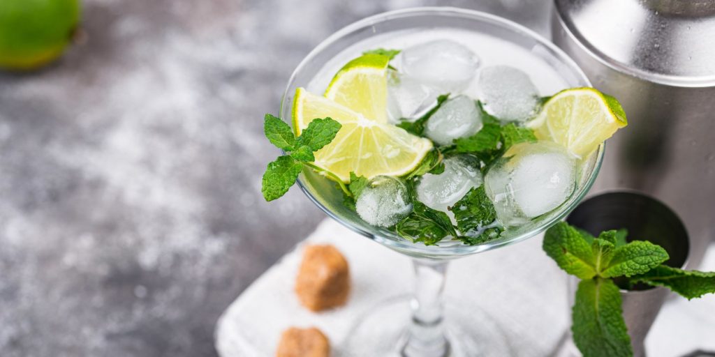 A refreshing Daisy Cutter Martini cocktail garnished with mint