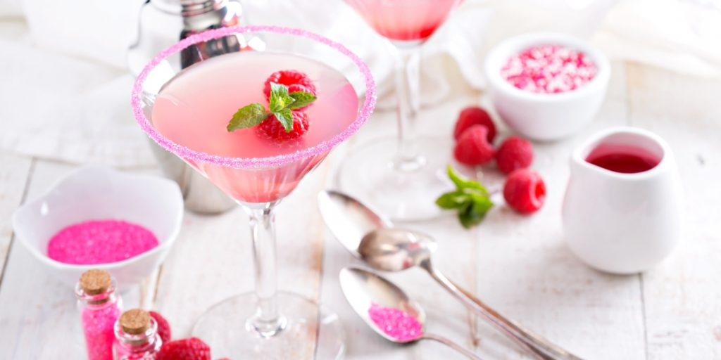 Two raspberry Martini cocktails