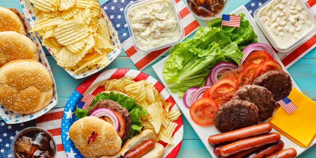 Close up top view of a DIY burger set-up for a Memorial Day party at home