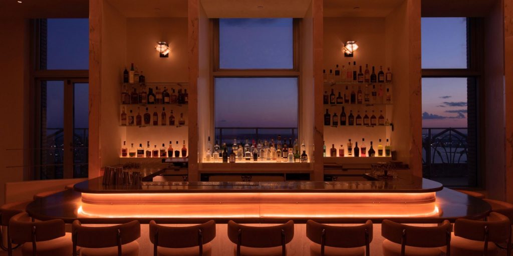 Incredible front view of the Overstory cocktail bar in NYC at dusk taken by Natalie Black
